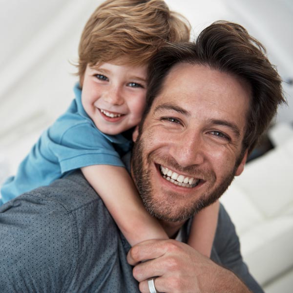 father and son smiling