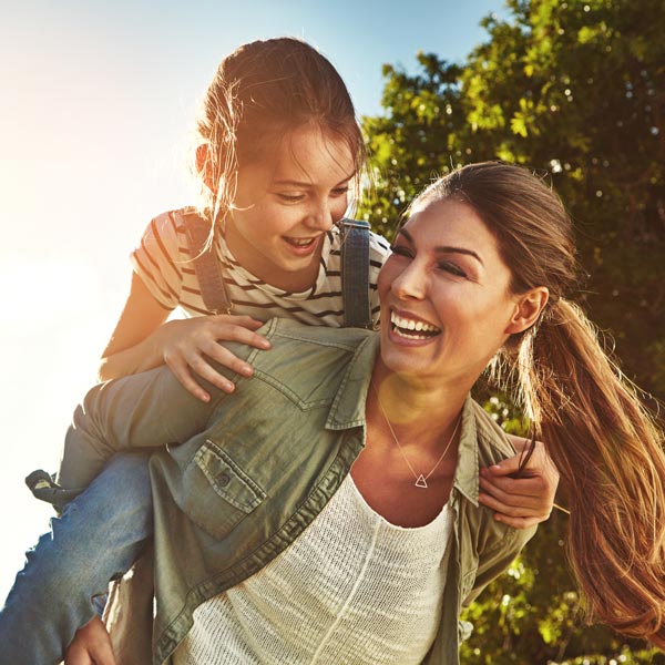 smiling mother and daughter